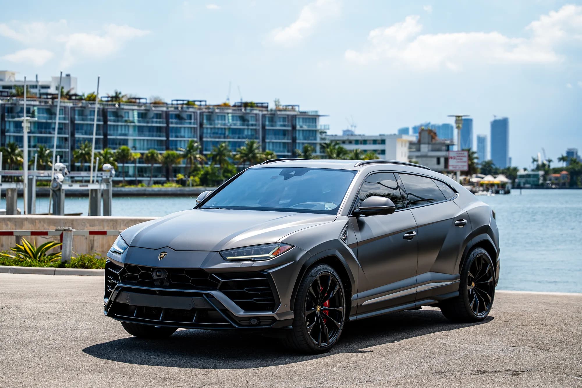 Lamborghini Urus — front three-quarter on the Miami waterfront at midday