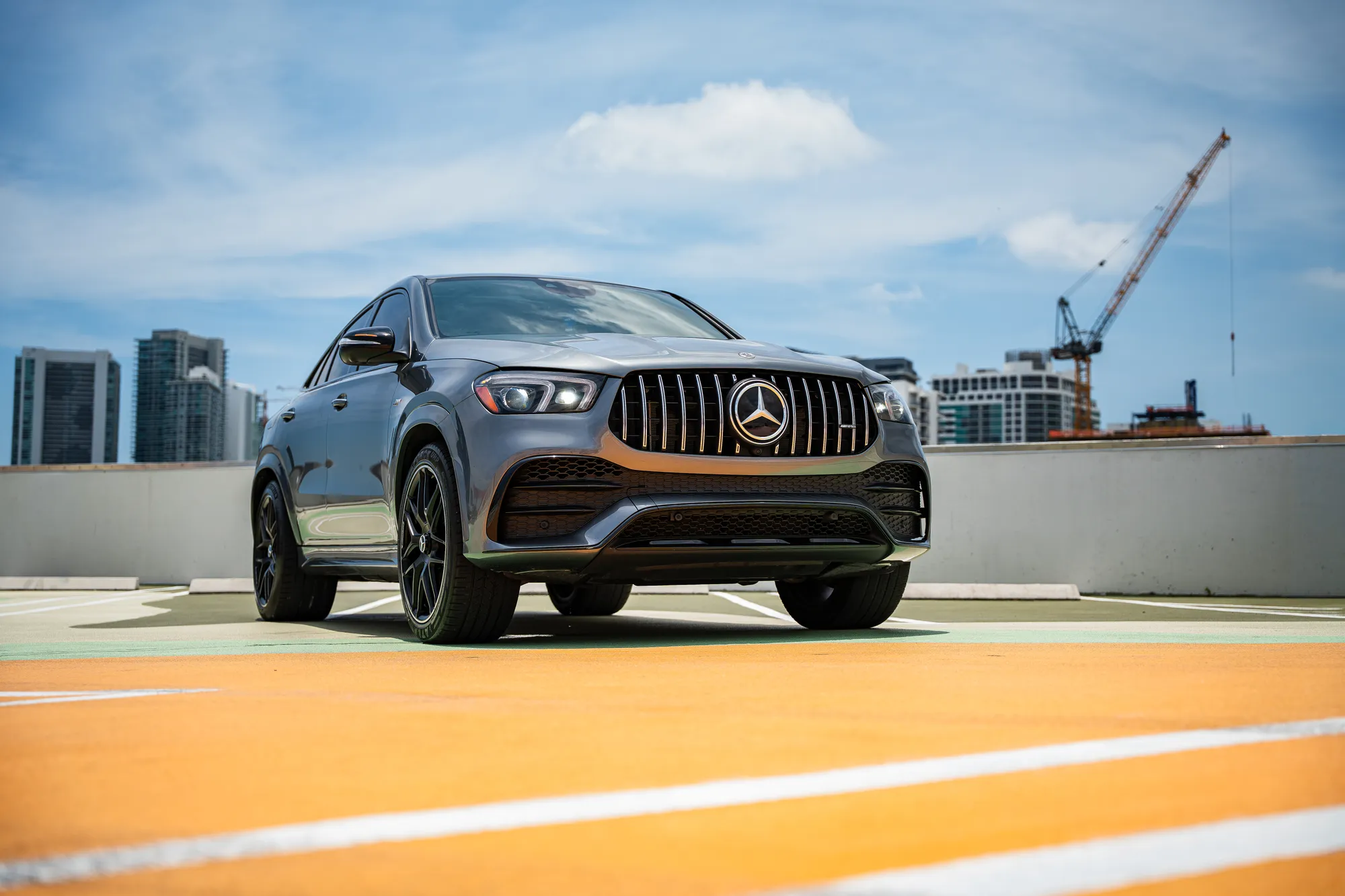 Mercedes-AMG GLE 53 Coupe — front three-quarter, Miami skyline