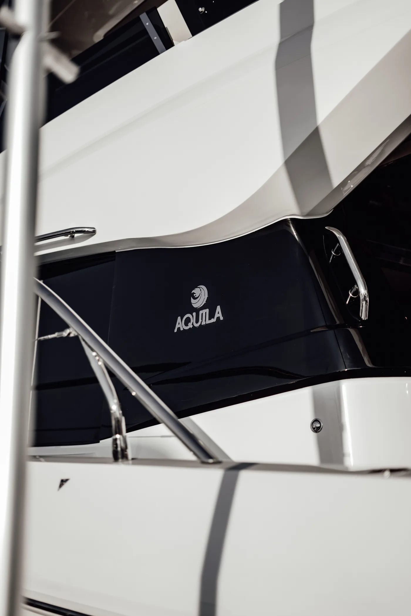 The Aquila hull with its branding at the dock