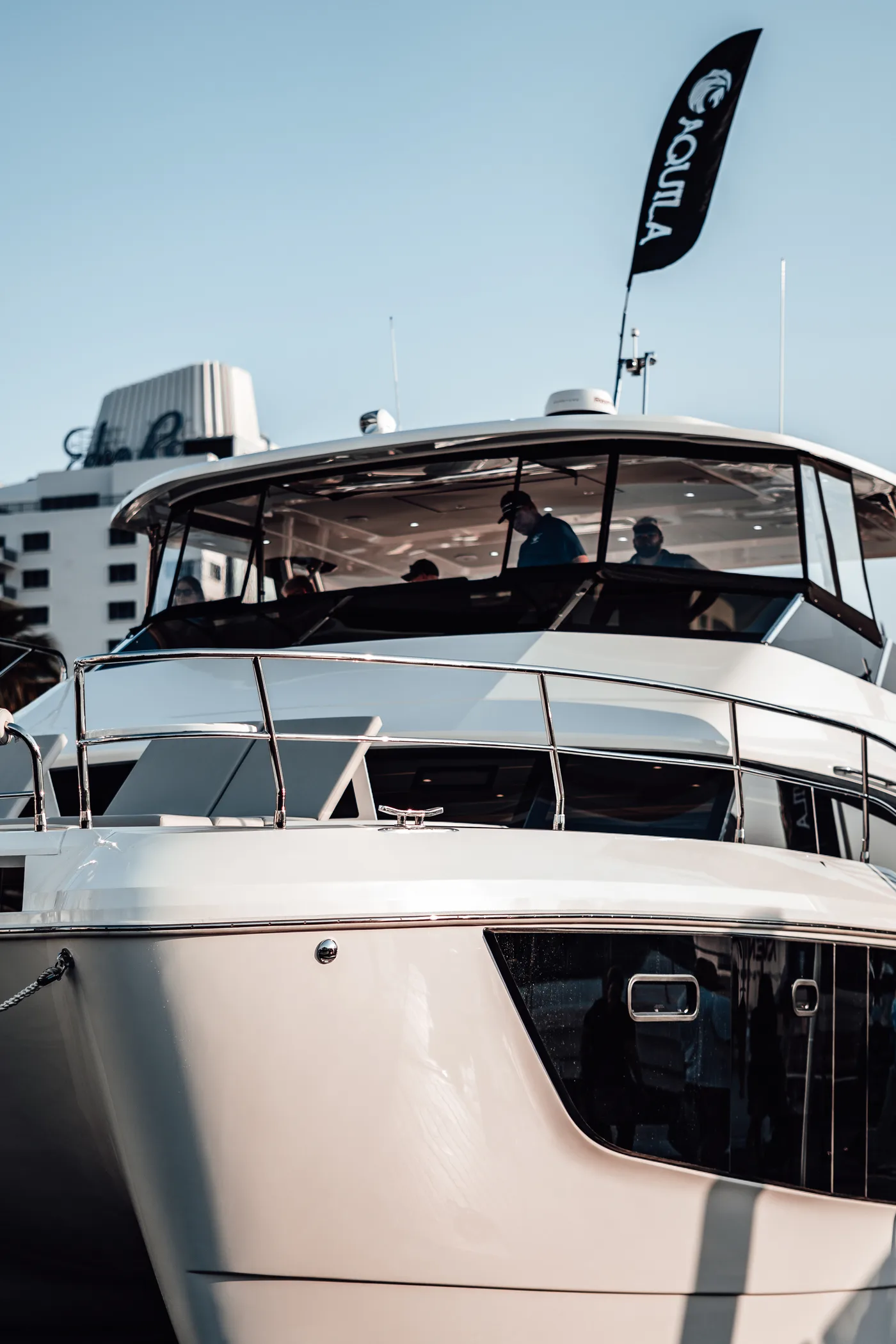 The Aquila catamaran bow with its brand flag