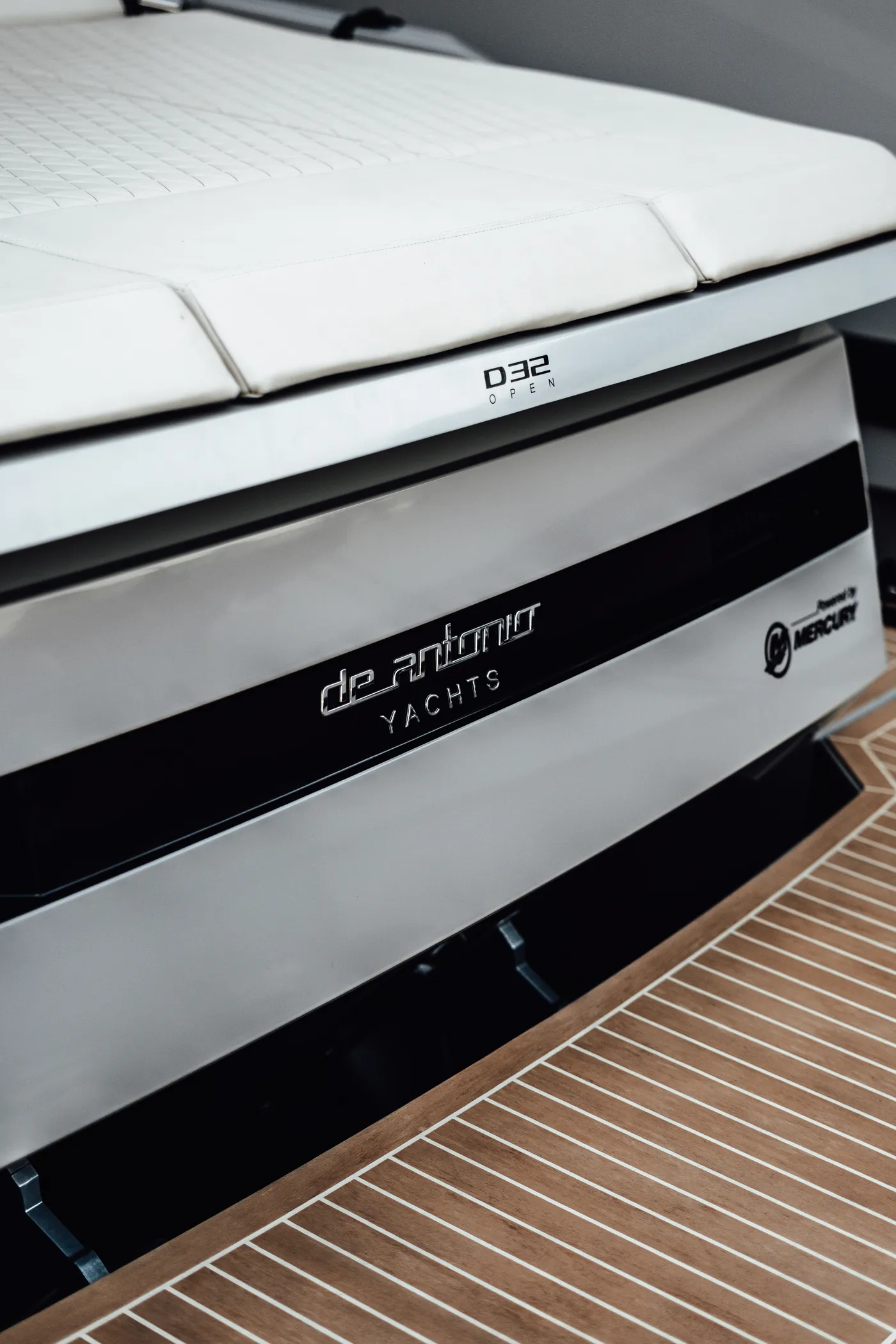 De Antonio D32 — hull branding and teak deck