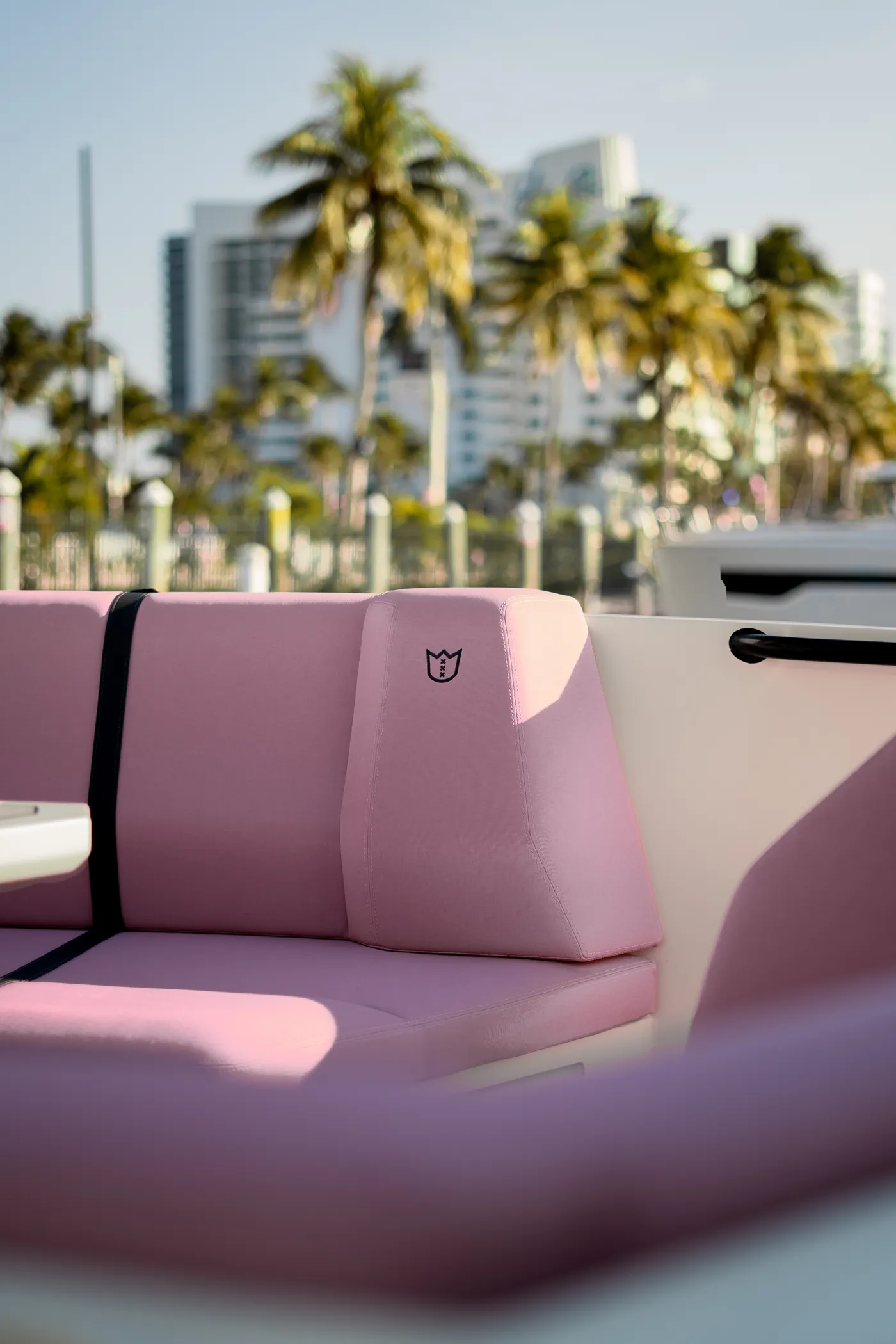 Lekker — signature pink lounge with Miami behind