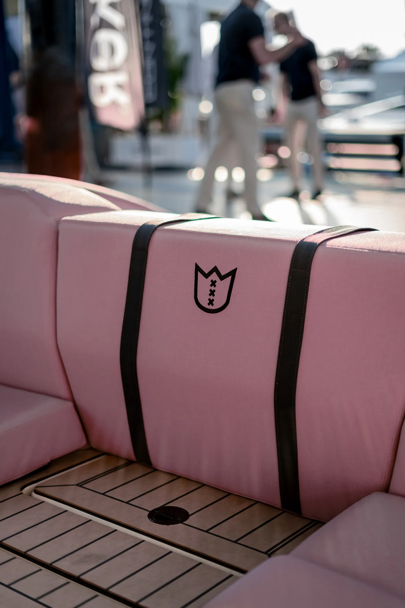 Lekker — pink bench seating with the crown logo