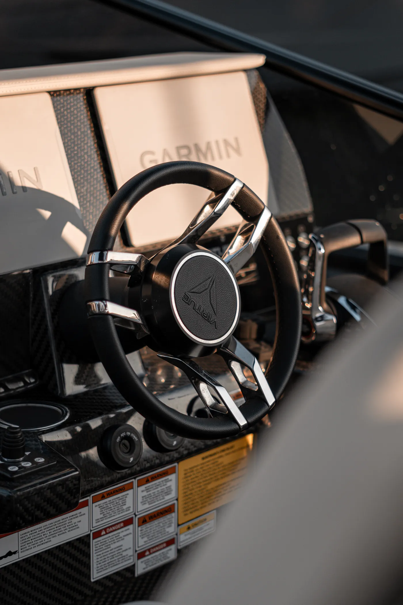 Virtue — helm wheel and Garmin dash