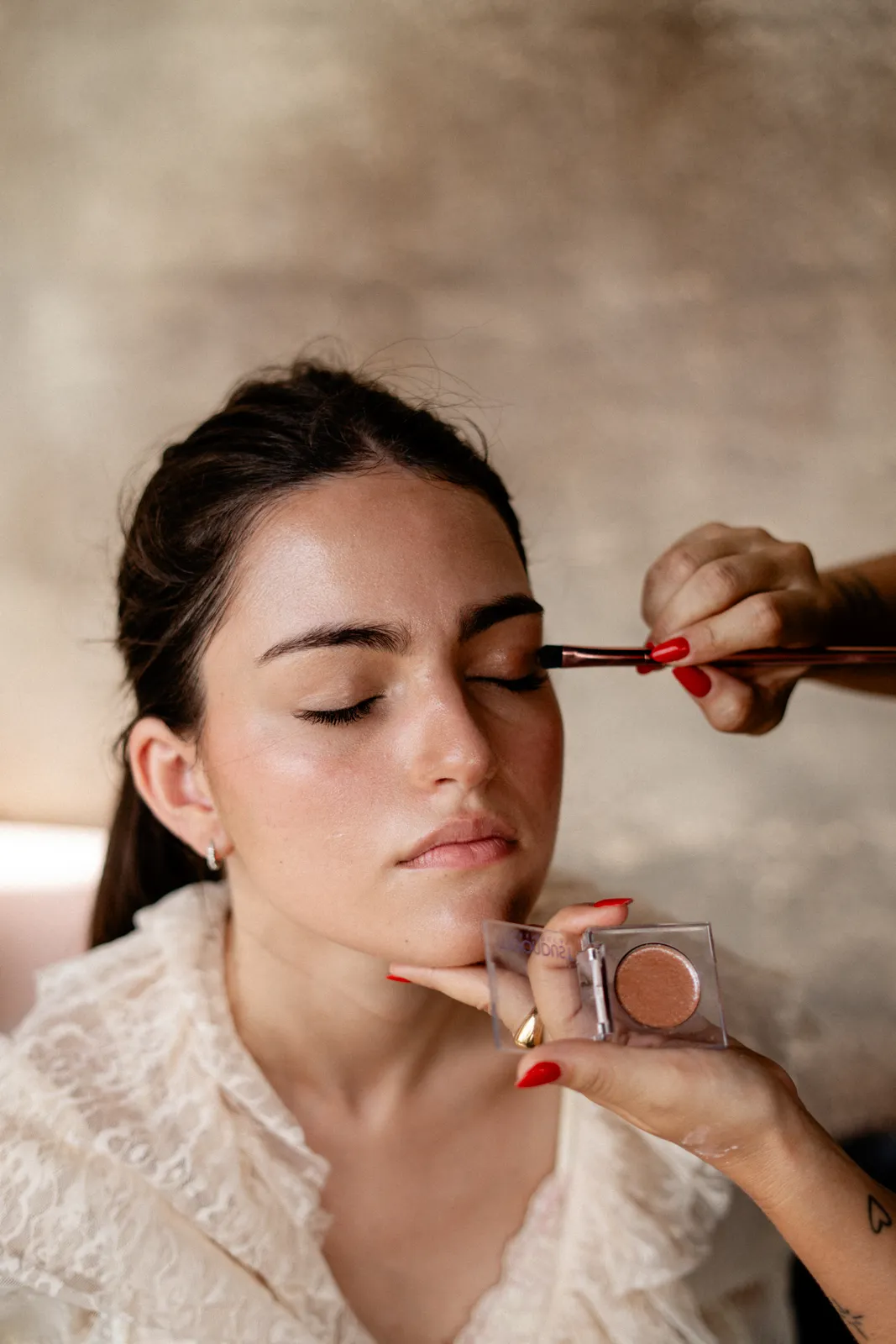 Makeup applied in close detail before the runway