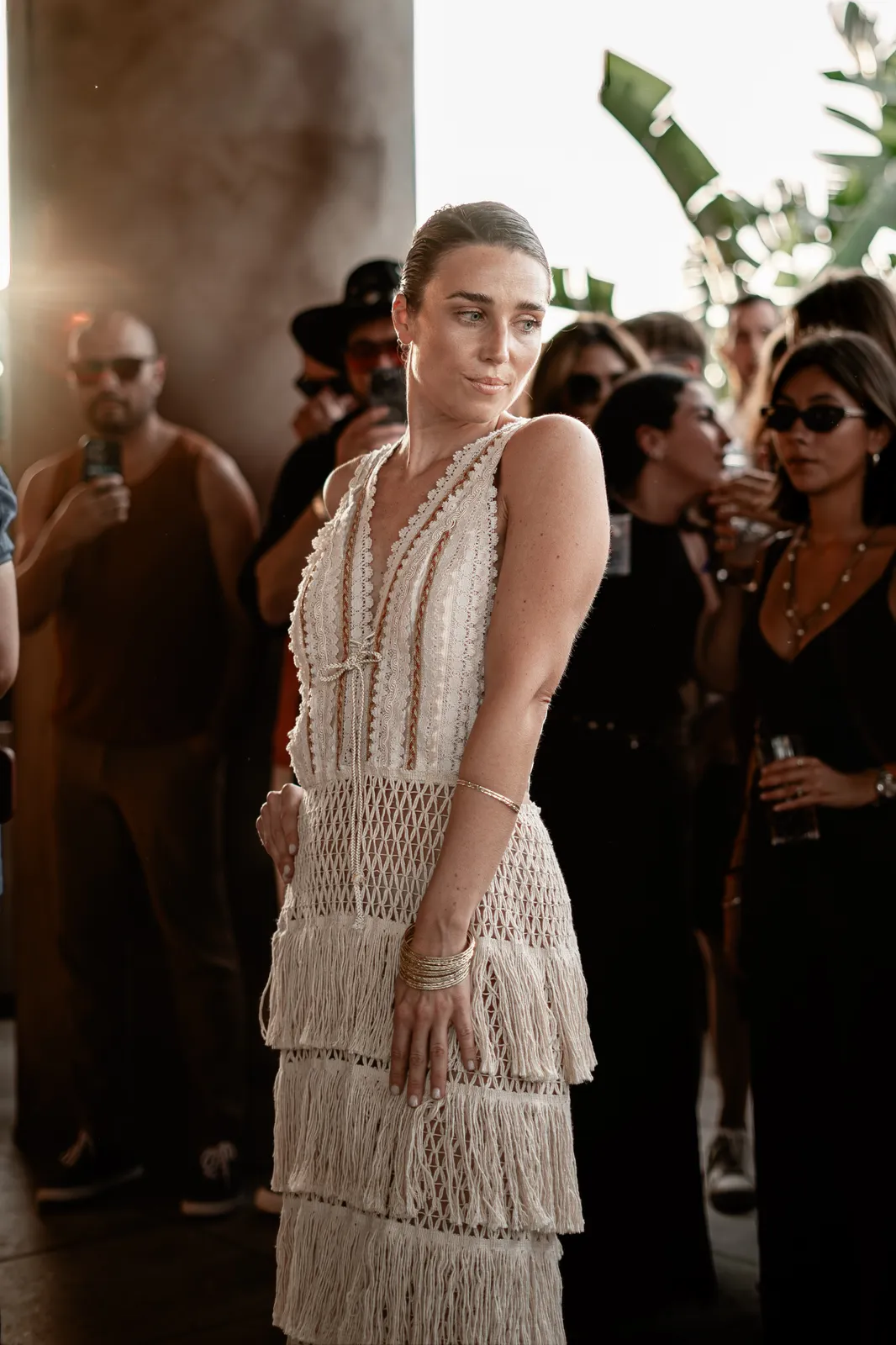 A model opening the runway in a white fringe look