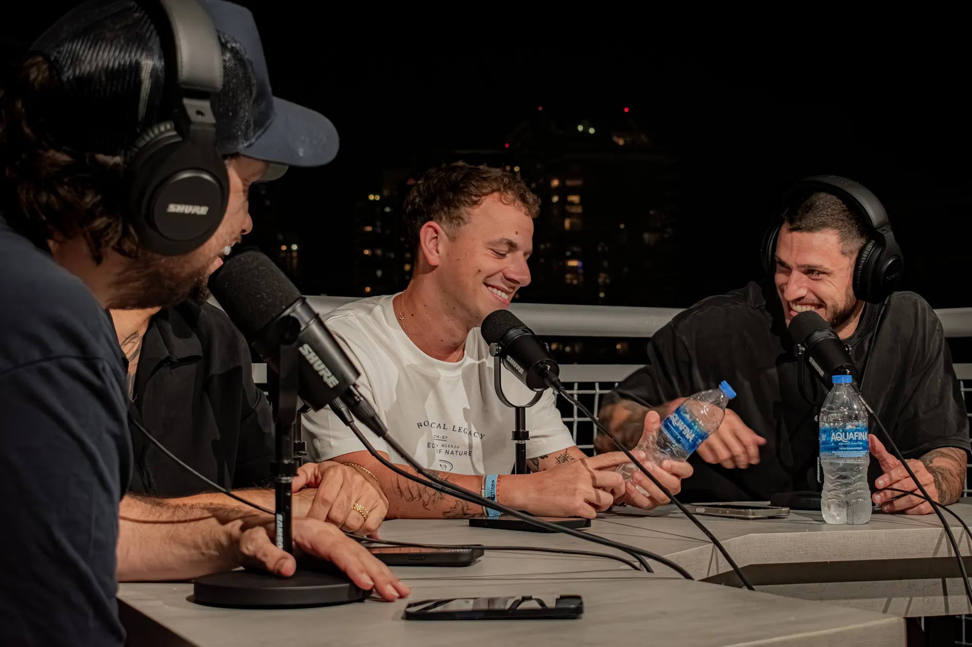Microphones and headphones around the table