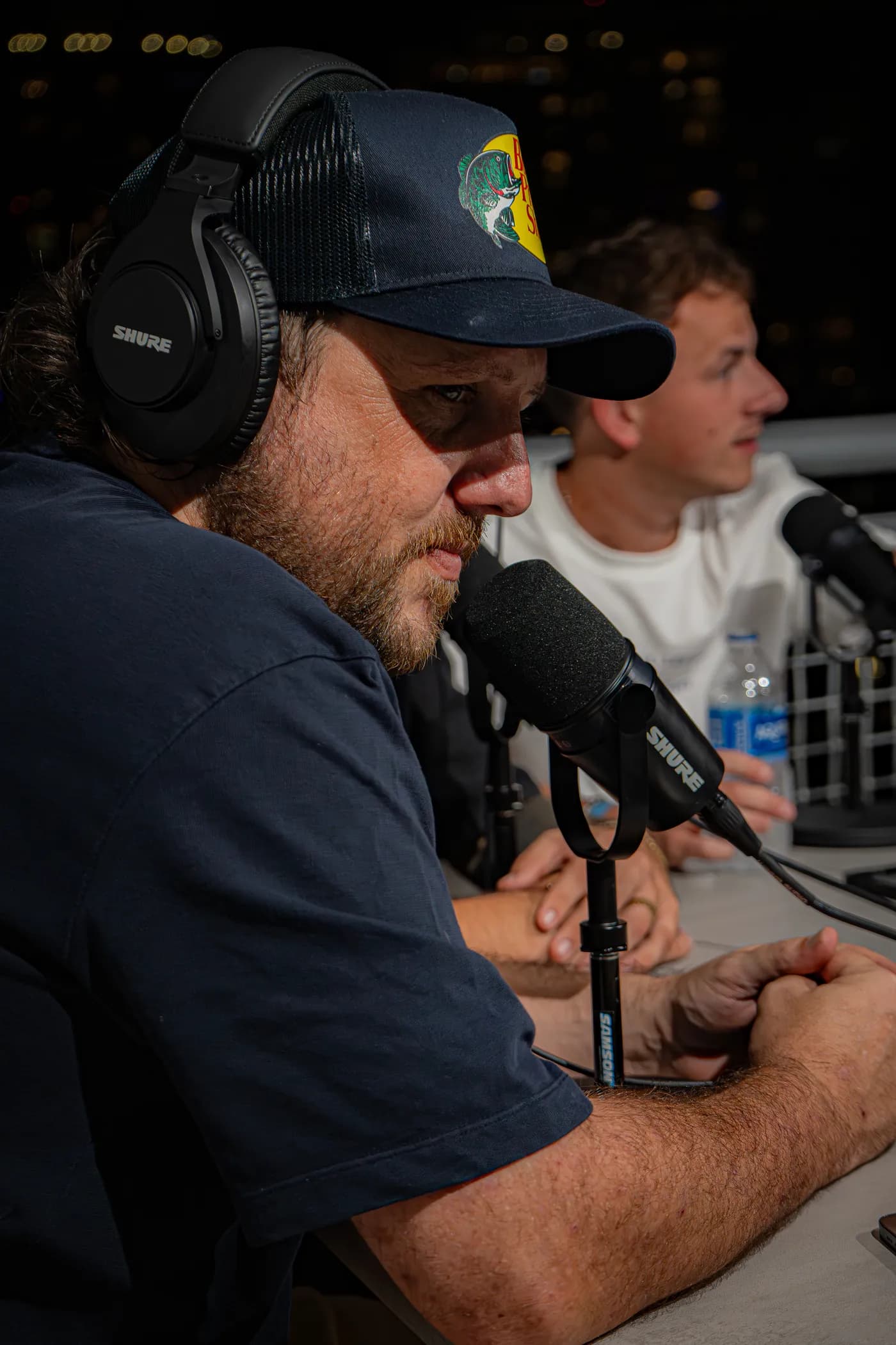 Leaning into the microphone
