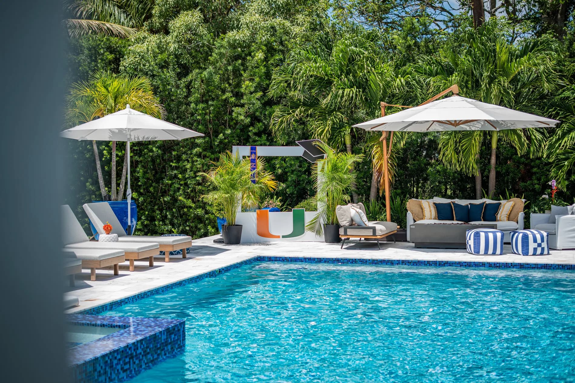 Umbrellas and loungers set along the pool