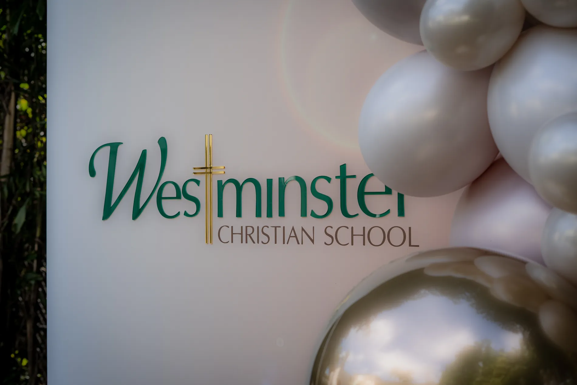 School signage and balloon work in position