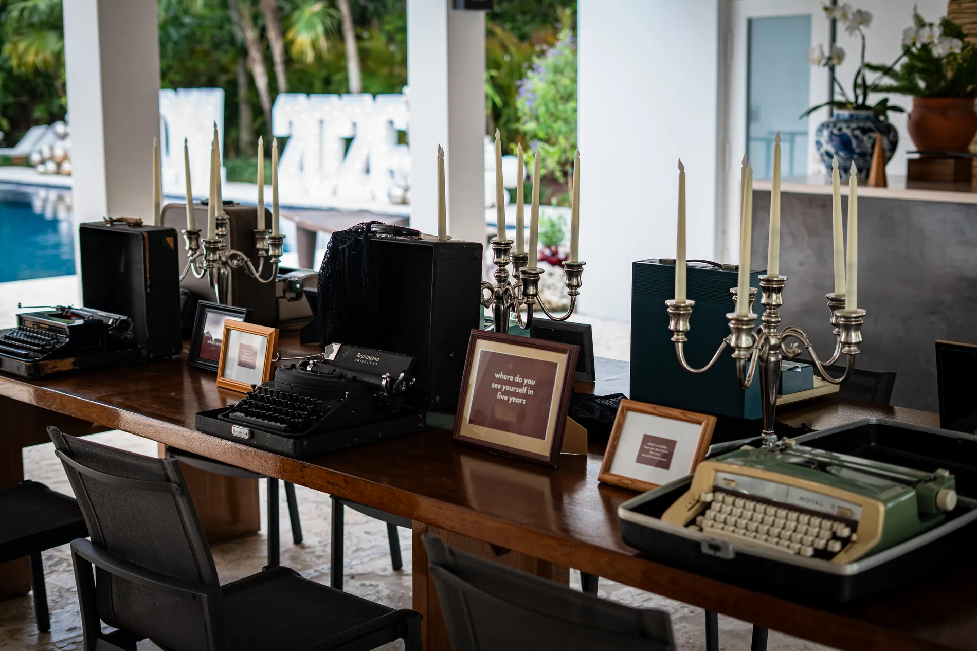 Vintage typewriters and candles on the console piece