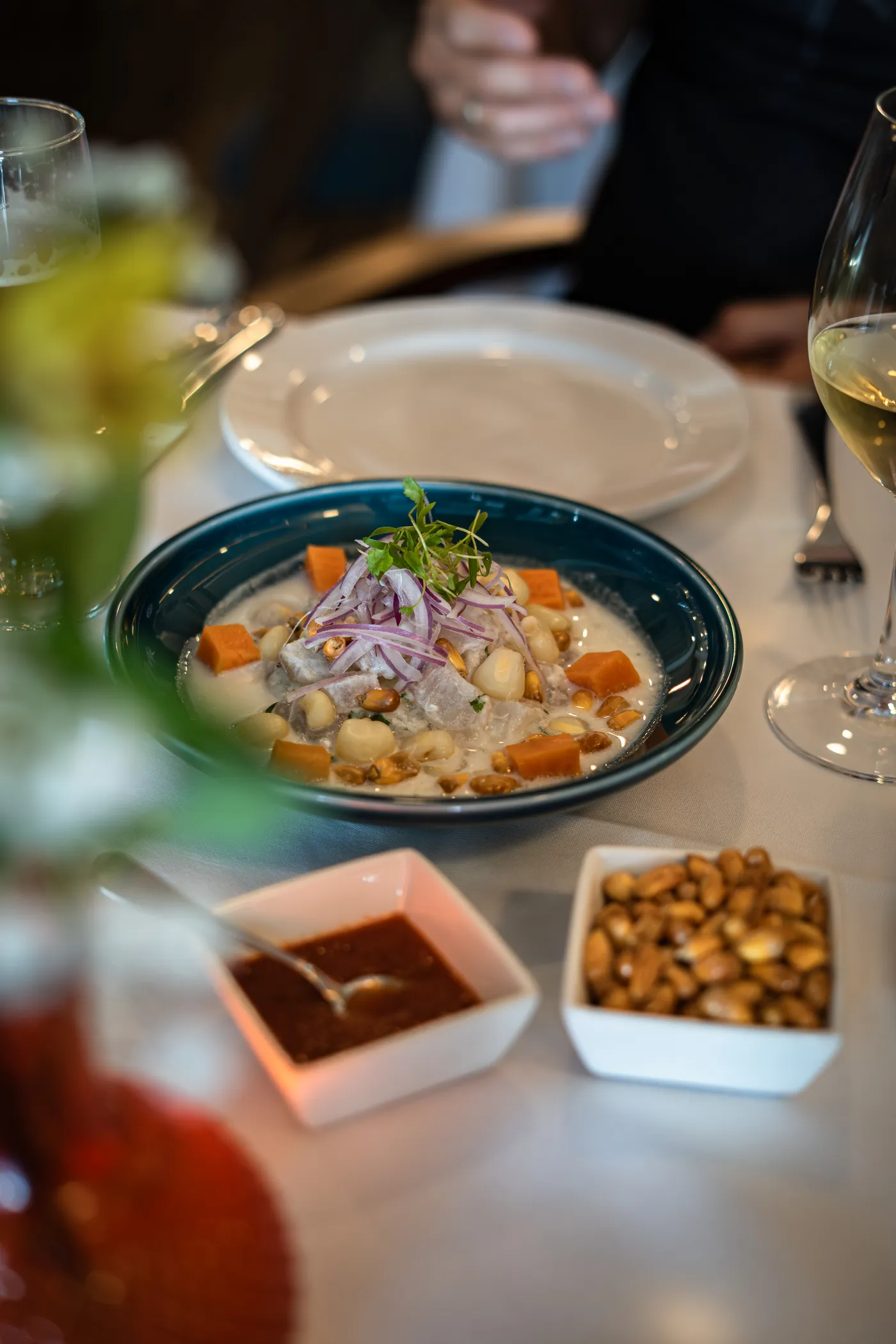 Ceviche served with cancha and sauces