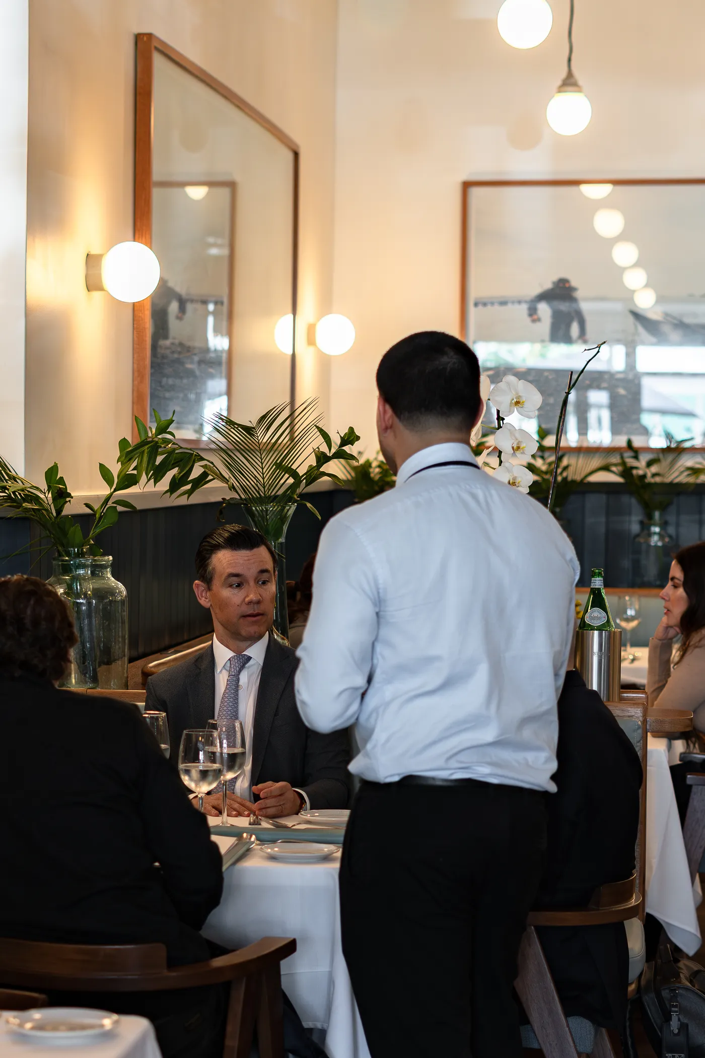 A server attending a table