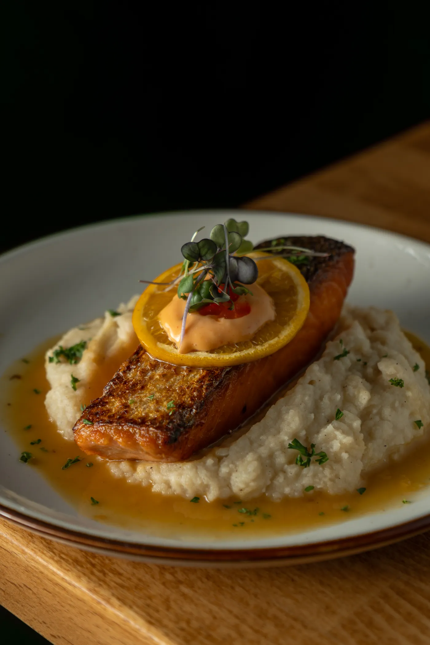 Crispy salmon over risotto with citrus