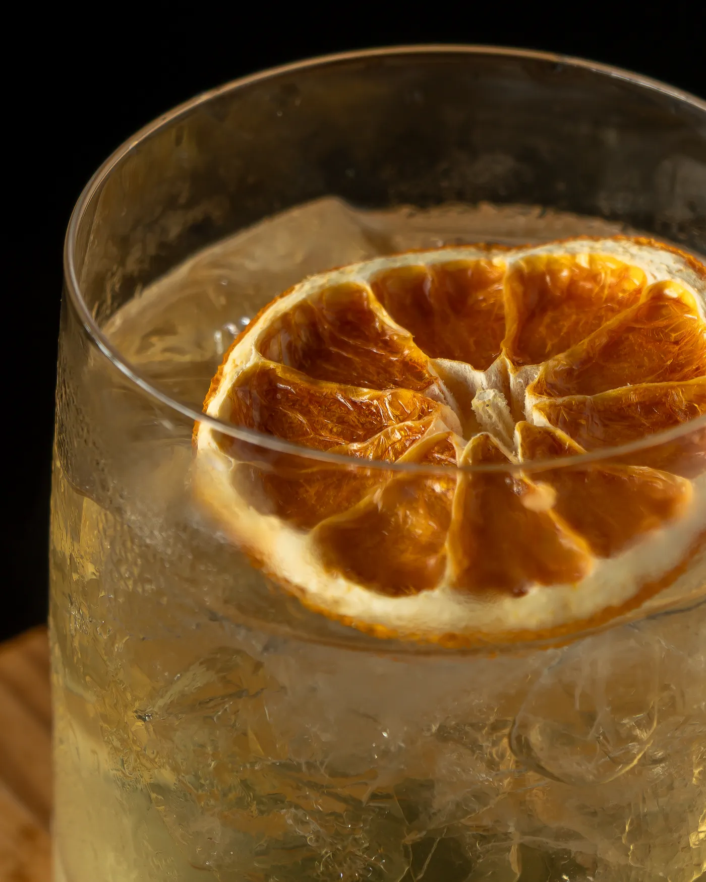 A smoked highball with a dried-orange wheel