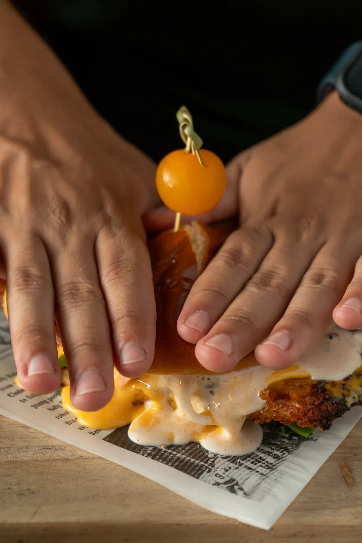 A melted cheese sandwich, pulled apart