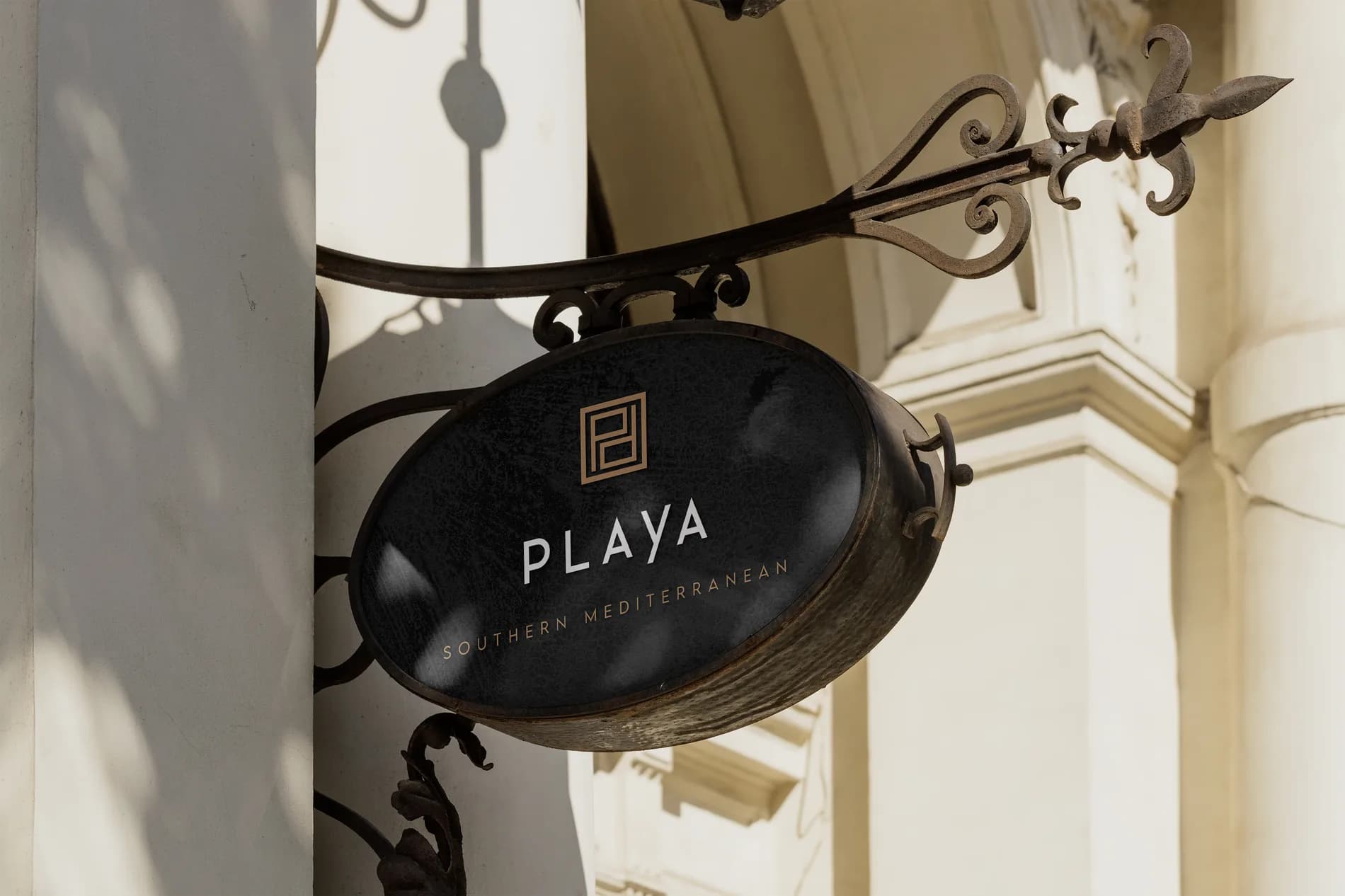 A hanging Playa sign mocked up