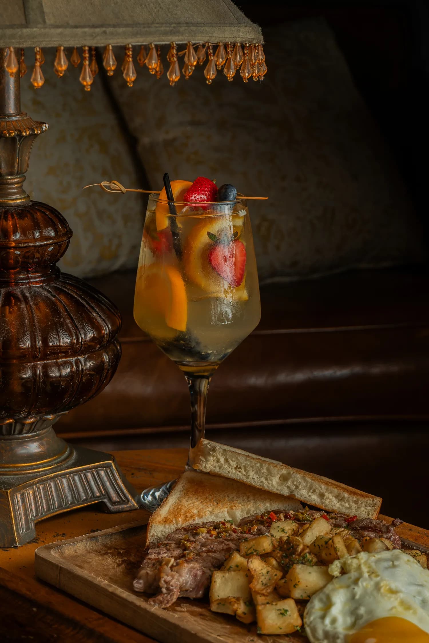 A white-wine sangria beside a steak-and-eggs board
