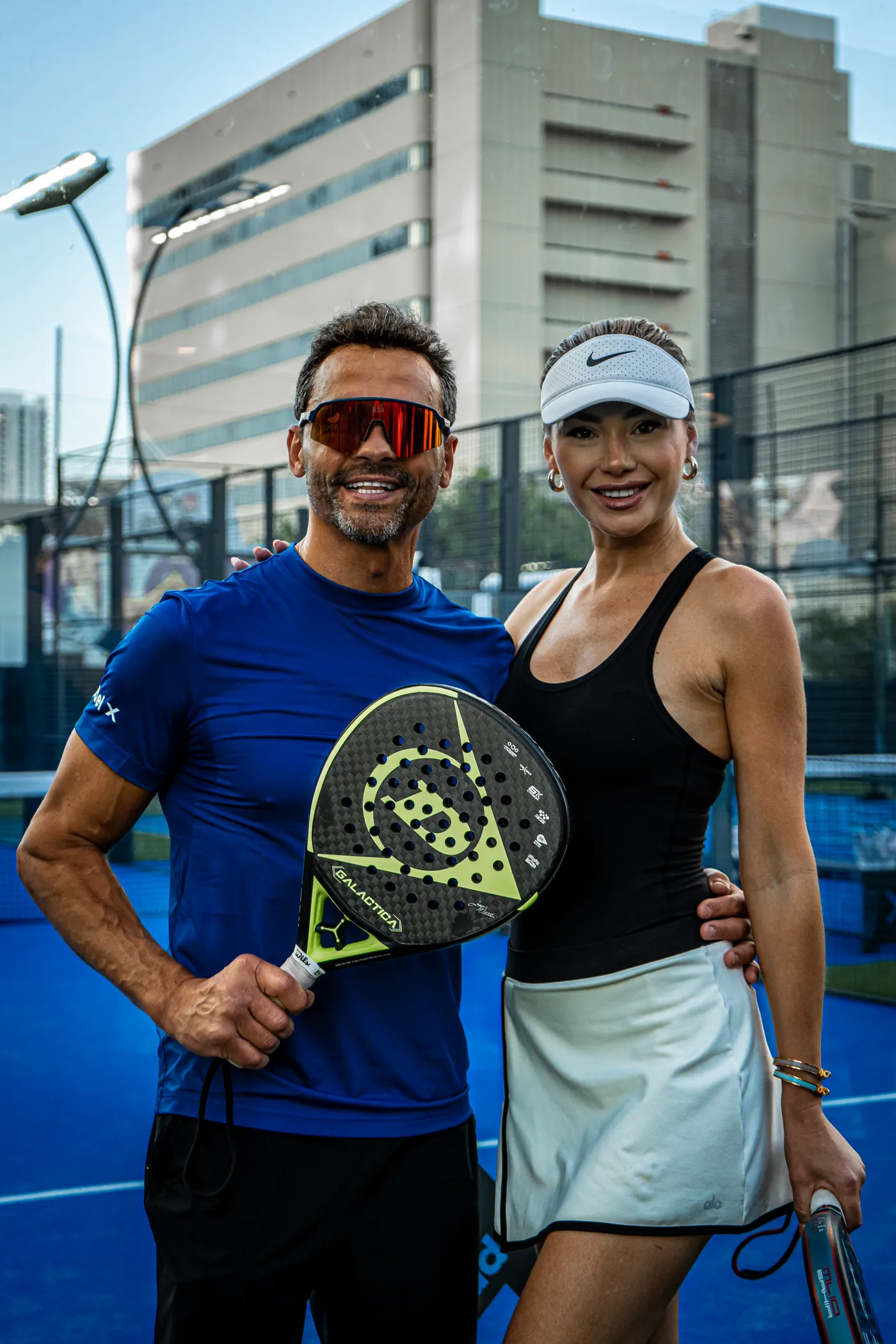A pair on court with their rackets