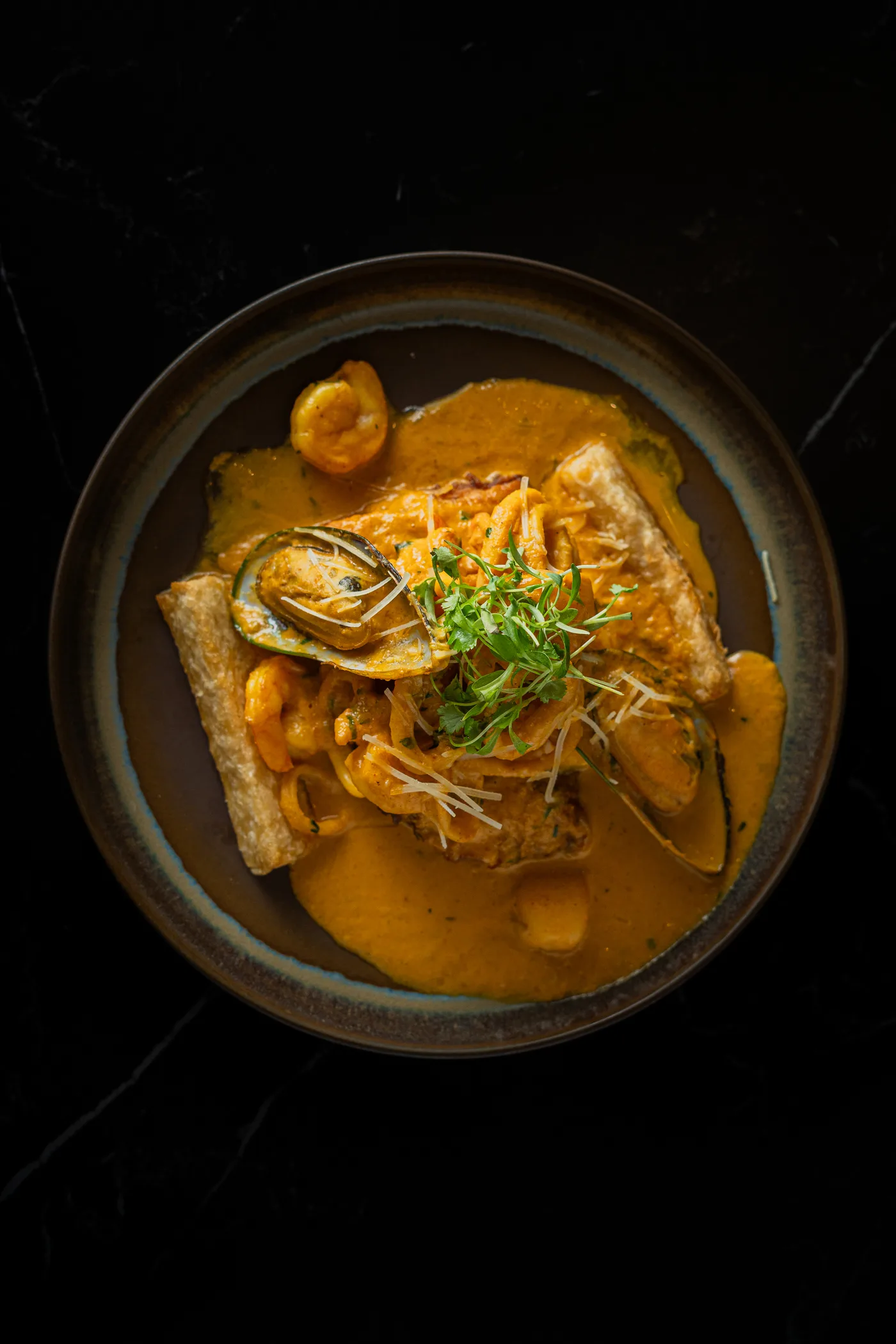 Seafood with oysters in a warm ají sauce